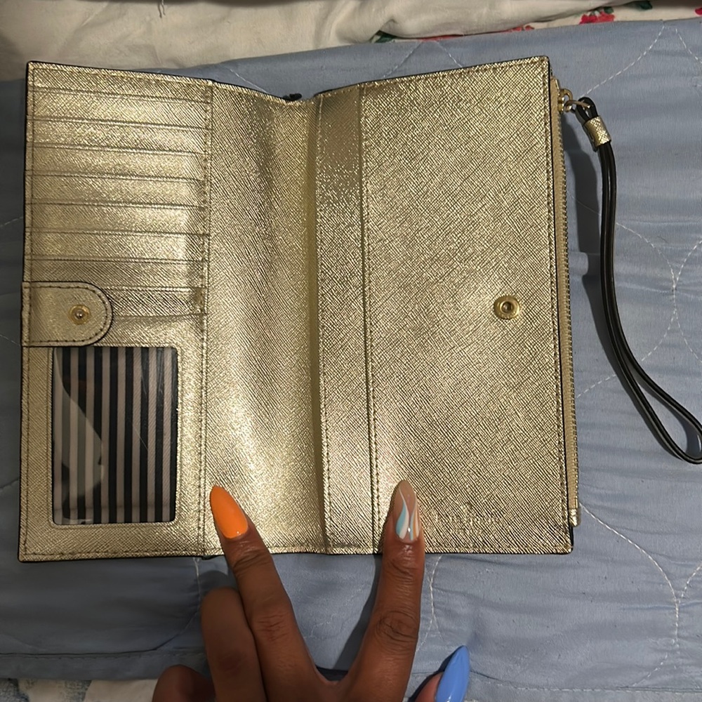 Auth. Kate Spade wallet with card slots and wrist strap